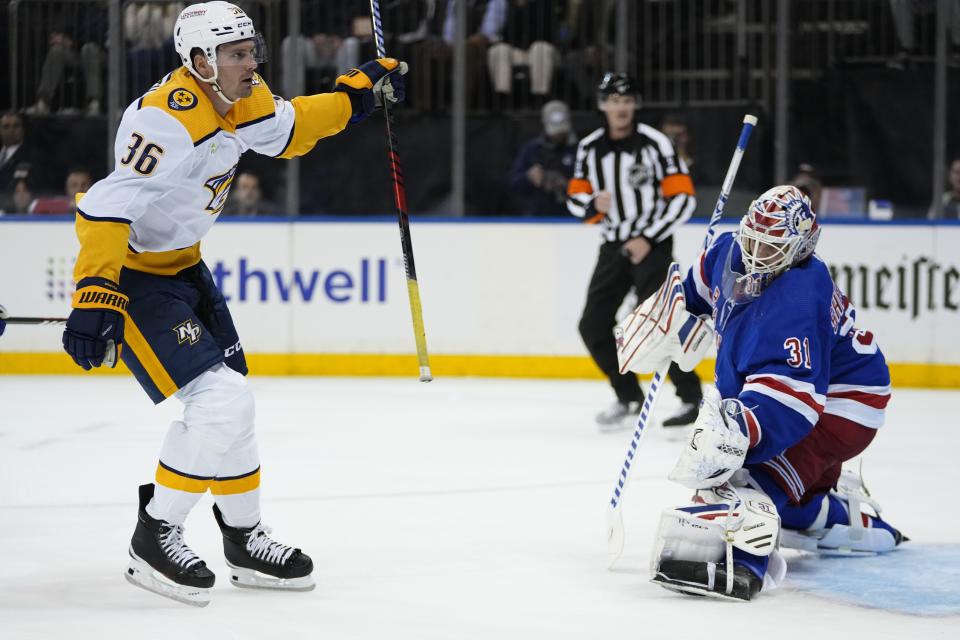 Nashville Predators' Cole Smith (36) skates past New York Rangers goaltender Igor Shesterkin (31) after scoring a goal during the first period of an NHL hockey game Thursday, Oct. 19, 2023, in New York. (AP Photo/Frank Franklin II)