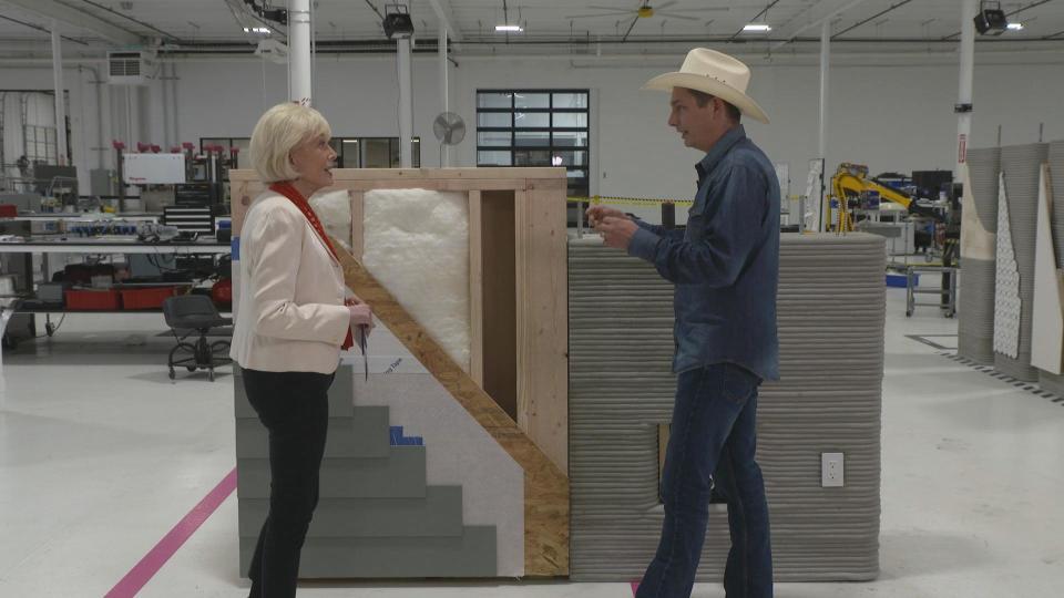 Jason Ballard demonstrated the difference between a conventionally built wall and a 3D-printed wall.  / Credit: 60 Minutes