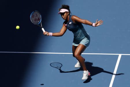 Mar 22, 2019; Miami Gardens, FL, USA; Naomi Osaka of Japan hits a volley against Yanina Wickmayer of Belgium (not pictured) in the second round of the Miami Open at Miami Open Tennis Complex. Mandatory Credit: Geoff Burke-USA TODAY Sports