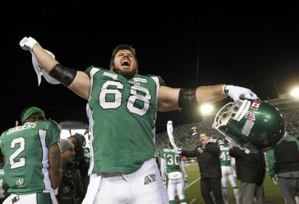 The Saskatchewan Roughriders Dominic Picard celebrates near the end of play against the Hamilton Tiger-Cats during the CFL's 101st Grey Cup championship football game in Regina, Saskatchewan November 24, 2013. REUTERS/David Stobbe (CANADA - Tags: SPORT FOOTBALL)