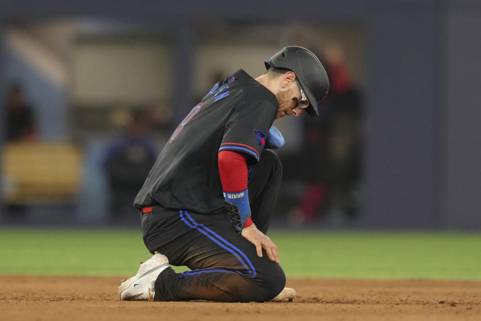 Toronto Blue Jays' Danny Jansen reacts after he was out on a double play hit into by Isiah Kiner-Falefa during the eighth inning of the team's baseball game against the New York Yankees on Friday, June 28, 2024, in Toronto. (Chris Young/The Canadian Press via AP)