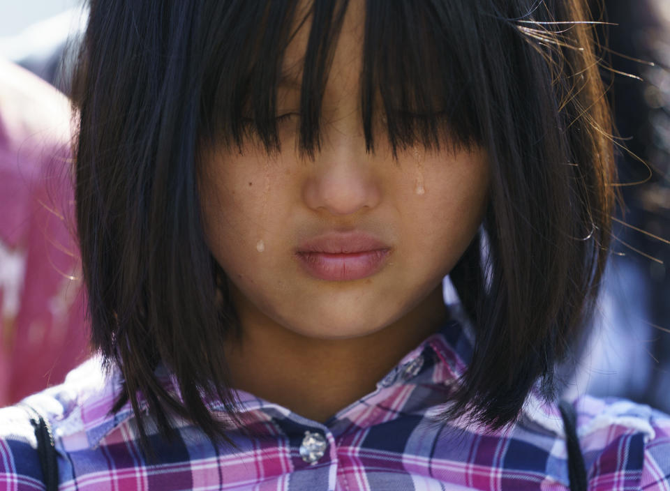 <p>Tears run down the face of Naomi Liem, 10, of Franklin Park, N.J., on Capitol Hill in Washington, Tuesday, June 26, 2018, during a protest against immigrant families being split up. Liem’s father, Guanuawan Liem, is currently being detained by ICE. (Photo: Carolyn Kaster/AP) </p>