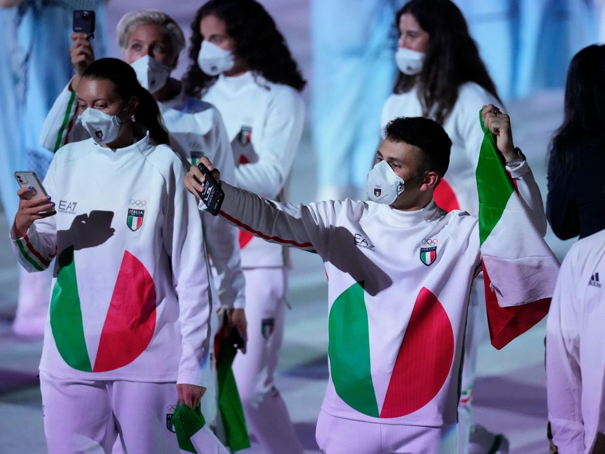 Italian athletes make their walk during the opening ceremony of the Tokyo Olympics.