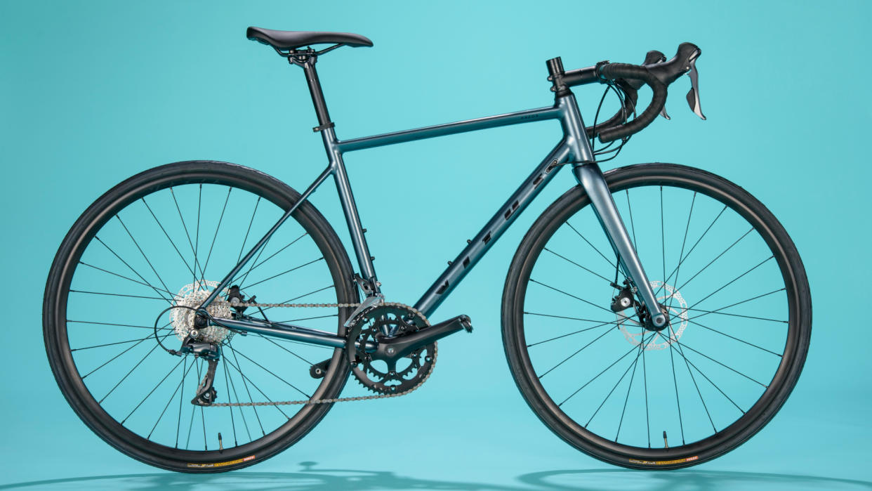  Vitus Razor Disc Road Bike Claris on a blue background 