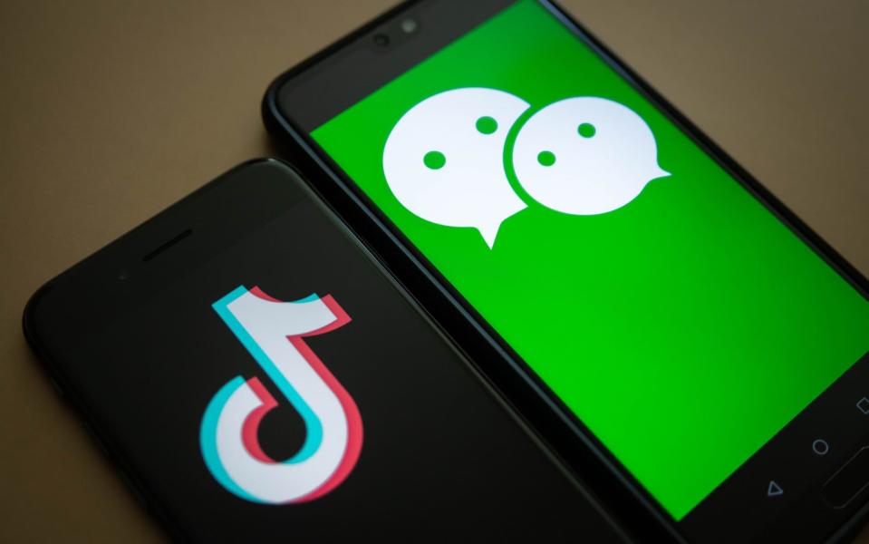 The TikTok and WeChat logos on smartphones