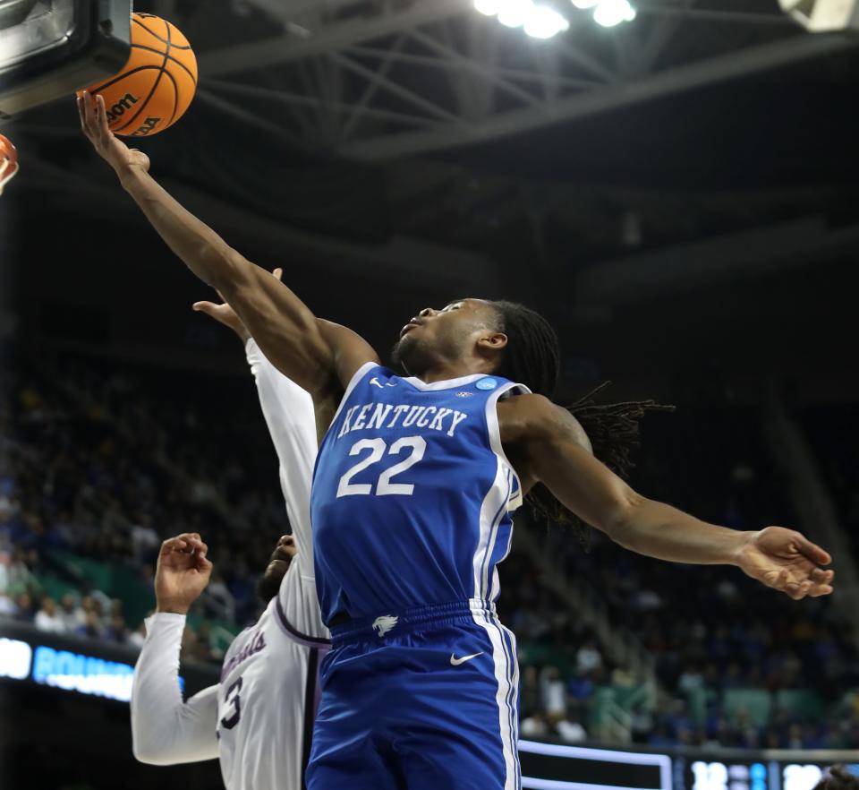 Kentucky’s Cason Wallace makes a shot against Kansas State’s David N’Guessan in the second round of the NCAA Tournament.March 19, 2023