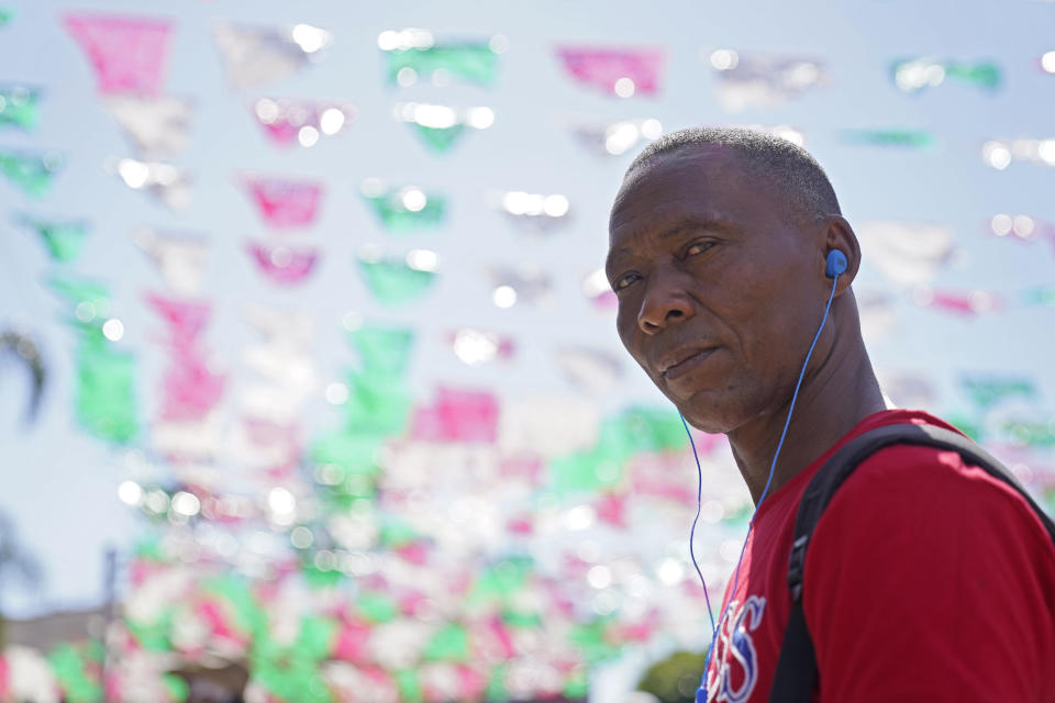 Jean Robert Jean Baptiste looks at the camera in Tijuana, Mexico, Thursday, June 9, 2022. Jean Baptiste said he took a charter flight to Brazil after he was deported from the U.S. and has since made his way to Tijuana. (AP Photo/Gregory Bull)