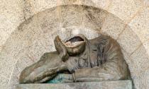 A damaged bust of Cecil John Rhodes, a controversial figure in the history of South Africa, is seen after the statue had been vandalised and had the head removed in Cape Town