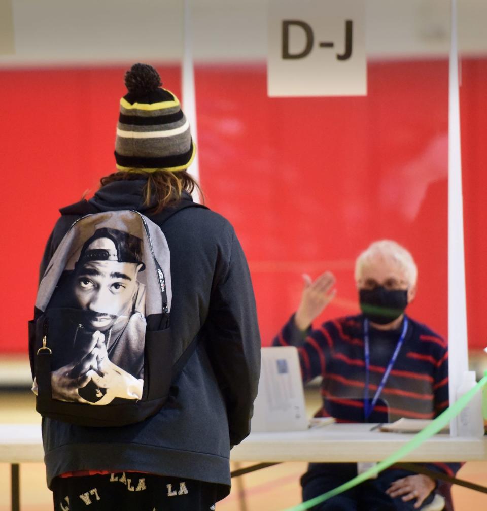 Voters at Rochester's Ward 5 wait their turn to be checked in at the community center in order to vote on Election Day.