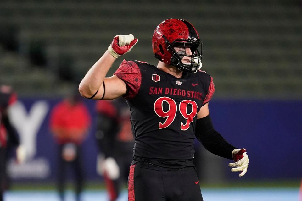 FILE - San Diego State defensive lineman Cameron Thomas (99) walks to the sideline during an NCAA football game against New Mexico Saturday, Oct. 9, 2021, in Carson, Calif. San Diego State plays against UTSA in the Frisco Bowl on Tuesday, Dec. 21.  (AP Photo/Ashley Landis, File)