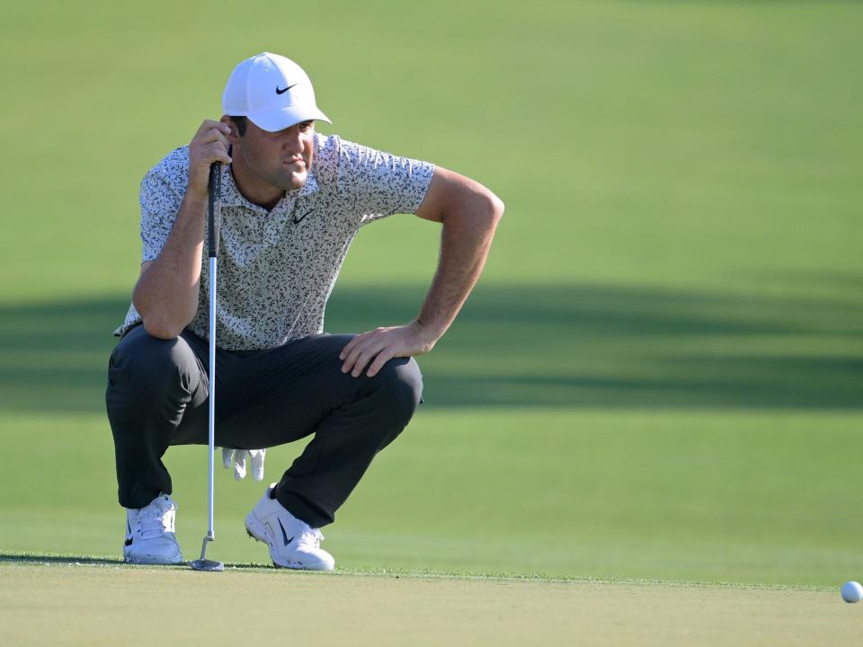 Scottie Scheffler reads the green at the Arnold Palmer Invitational.