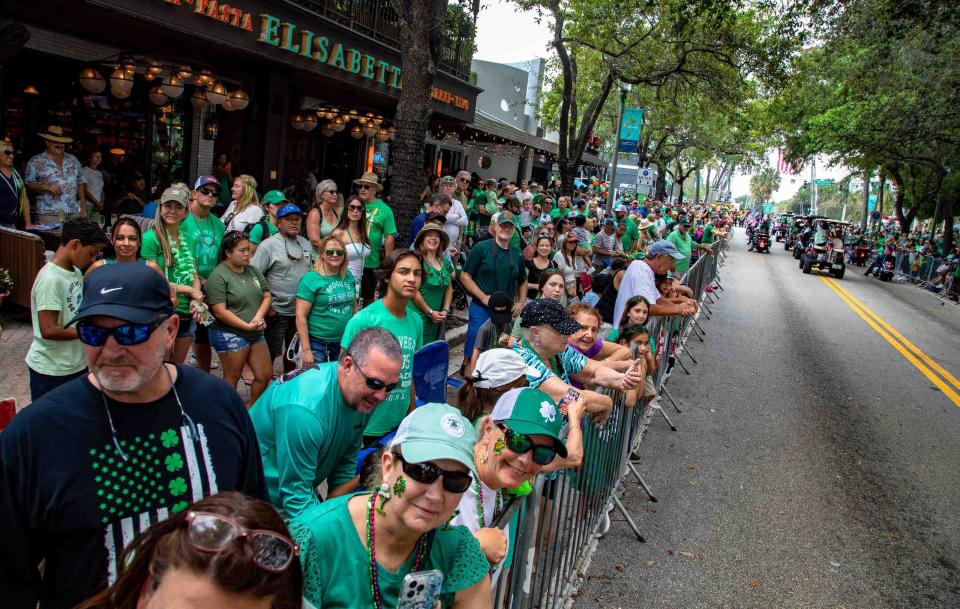 Community members crowd the sidewalk along Atlantic Ave. to take in the 53rd Annual Delray Beach St. Patrick's Day Parade March 11, 2023.