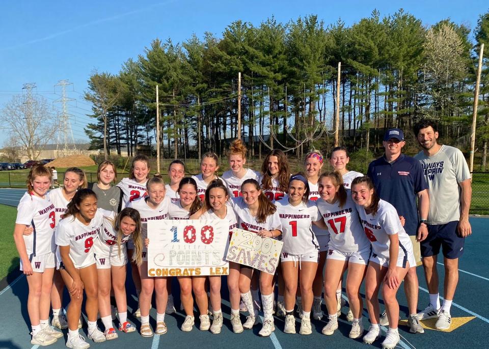 Wappingers girls lacrosse teammates celebrate Cassidy Schuchat and Alexa Cazzorla for reaching milestones during an April 21, 2023 game. Schuchat eclipsed 200 career saves and Cazzorla notched her 100th point.