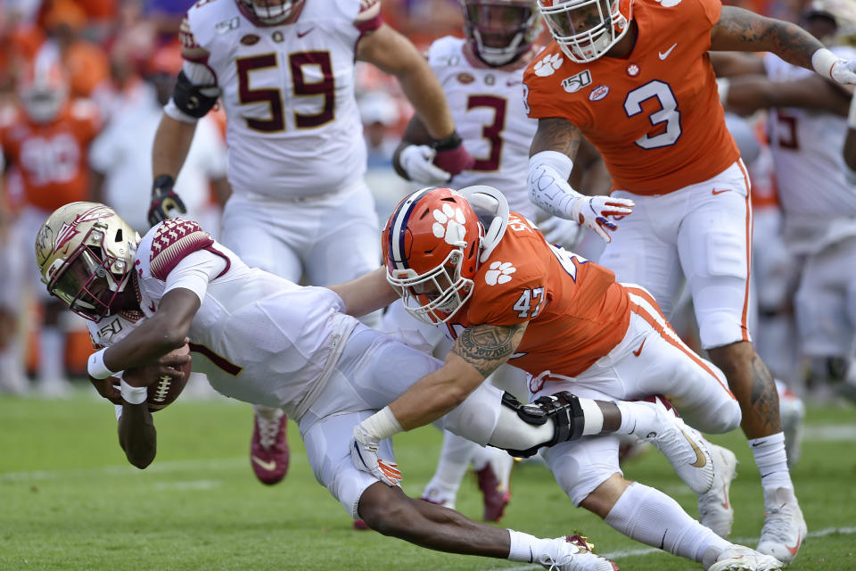 Florida State quarterback James Blackman is tackled by Clemson's James Skalski during the first half of an NCAA college football game Saturday, Oct. 12, 2019, in Clemson, S.C. (AP Photo/Richard Shiro)