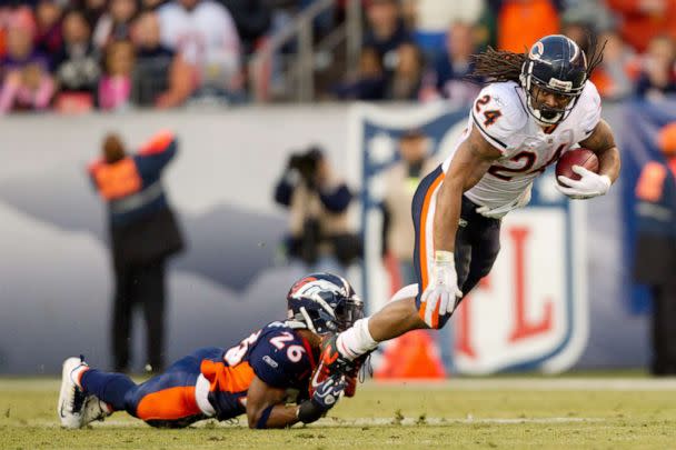 PHOTO: Running back Marion Barber of the Chicago Bears is tackled by safety Rahim Moore of the Denver Broncos, Dec. 11, 2011, in Denver. (Justin Edmonds/Getty Images, FILE)