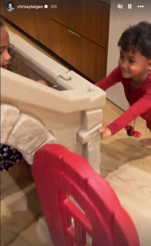 <p>Chrissy Teigen/Instagram</p> Chrissy Teigen builds a toy house with children Luna and Miles.