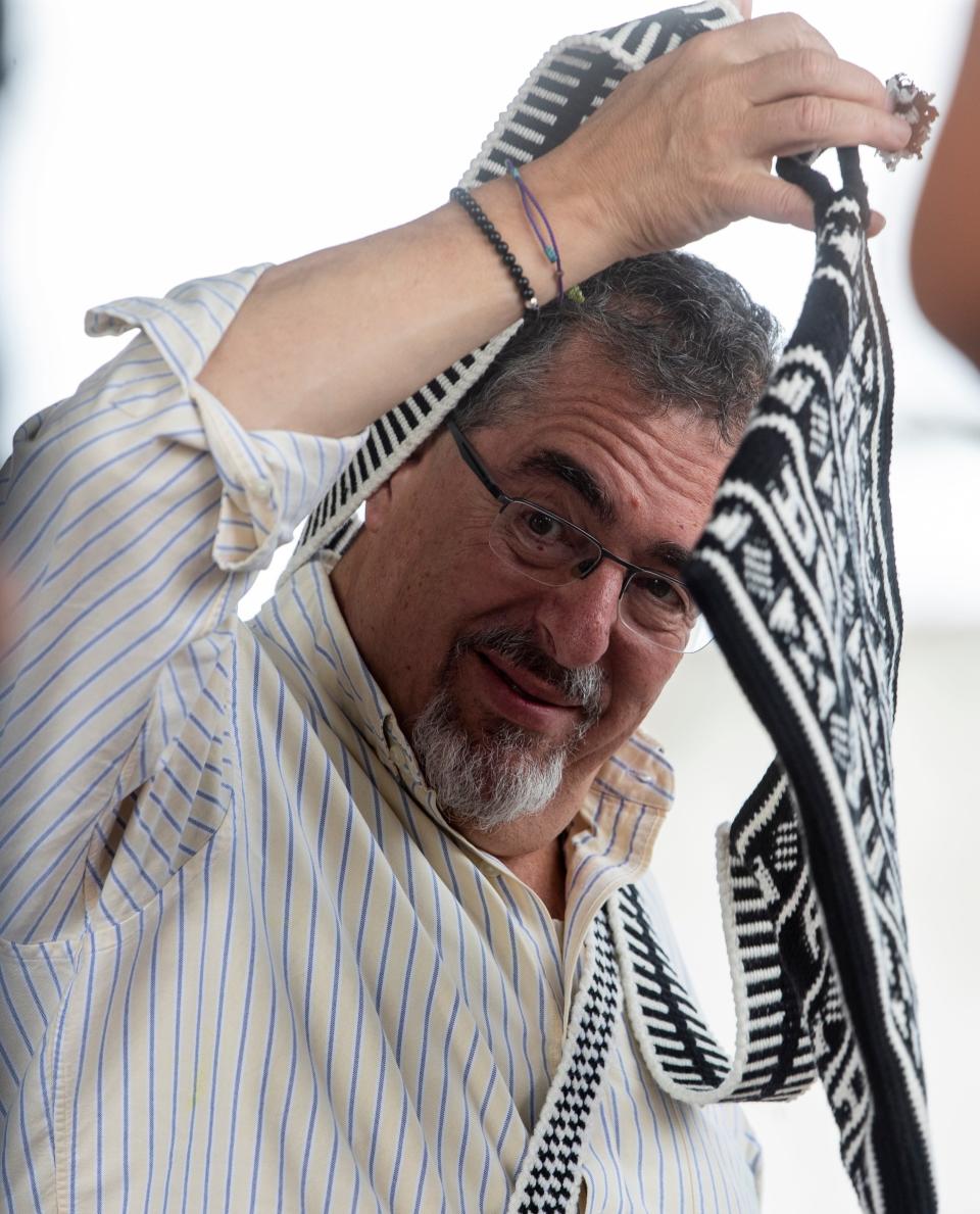 Presidential candidate for Movimiento Semilla, Bernardo Arevalo receives a gift from Mayan community leaders in Santa Cruz del Quiche, Guatemala on Aug.11, 2023, during a political rally.