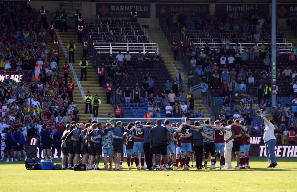 Burnley have a team huddle at the end of the English Premier League soccer match between Burnley and Nottingham Forest, at Turf Moor, in Burnley, England, Sunday, May 19, 2024. (Richard Sellers/PA via AP)
