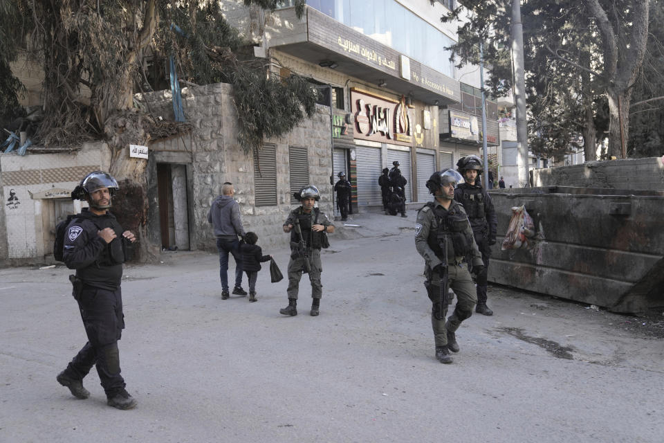 Israeli security forces are deployed in the the village of Anata in east Jerusalem, the hometown of Palestinian gunman Uday Tamimi, Wednesday, Jan. 25, 2023. Israeli forces on Wednesday demolished the home of Tamimi who allegedly killed a female Israeli soldier in an attack last year that sparked a manhunt and clampdown on the east Jerusalem neighborhood where he lived. (AP Photo/ Mahmoud Illean)