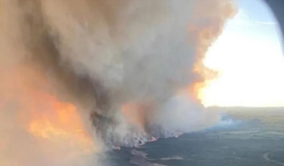 An arial image of the Parker Lake wildfire burning near Fort Nelson in British Columbia. Strong winds fueled the fire Sunday evening into Monday, officials said (BC Wildfire Service/AFP via Gett)