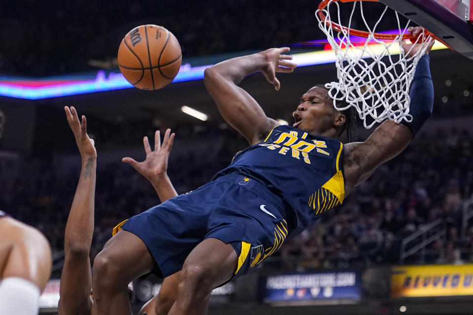 Indiana Pacers guard Bennedict Mathurin (00) reacts as he's fouled on a dunk against the Washington Wizards during the first half of an NBA basketball game in Indianapolis, Wednesday, Oct. 25, 2023. (AP Photo/Michael Conroy)