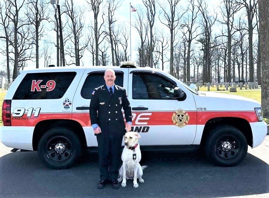 Vineland Fire Department Investigator Phillip McMahon stands with his new partner, Radiant, a 2-year-old Labrador retriever acquired from a local family. Radiant will work detecting accelerants at fire scenes. PHOTO: March 2024.