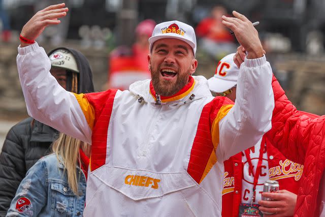 <p>Scott Winters/Icon Sportswire via Getty</p> Travis Kelce fires up the crowd during the Chiefs Super Bowl LVII Victory Parade