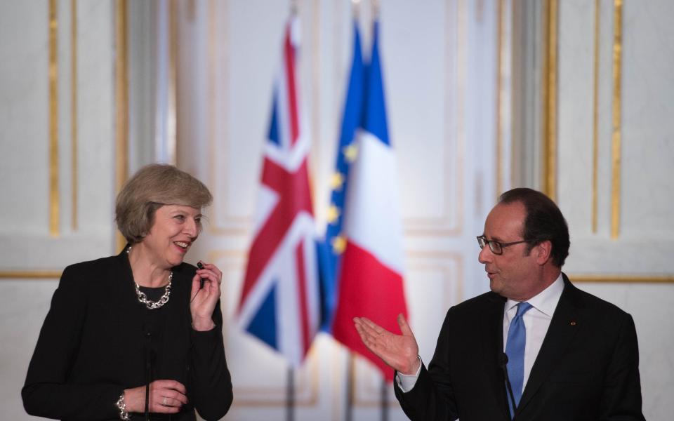 Theresa May and Francois Hollande  - Credit: Stefan Rousseau/PA Wire