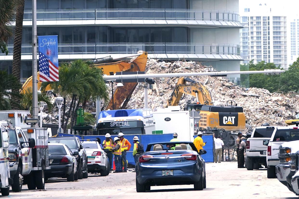 In this July 13 photo, crews work in the rubble of the Champlain Towers South building, as removal and recovery work continues at the site of the partially collapsed condo building in Surfside, Fla.  