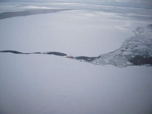 A United States Air Force photo from December 16, 2011 shows the Russian fishing boat Sparta stranded in the Antarctic. The nearest rescue vessels are still several days away and are being hampered from reaching the Sparta because of thick ice in the frozen Southern Ocean