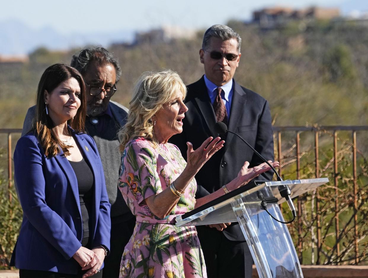 First lady Jill Biden and U.S. Department of Health and Human Services Secretary Xavier Becerra visit the home of Tucson Mayor Regina Romero (left) following a tour of the San Xavier Health Center on the Tohono O'odham Nation on March 8, 2022.