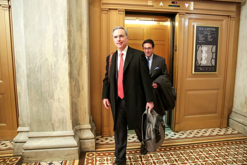 White House Counsel Cipollone and Trump's attorney Sekulow depart after concluding their opening arguments at Trump impeachment trial on Capitol Hill in Washington