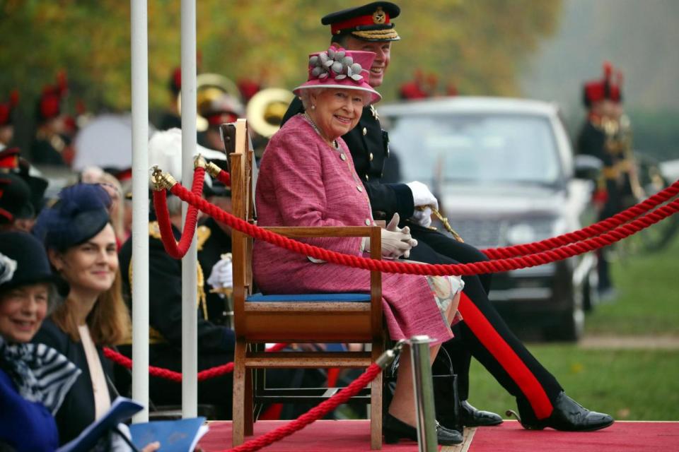 The Queen smiles as she watches the King's Troop Royal Artillery parade. (REUTERS)