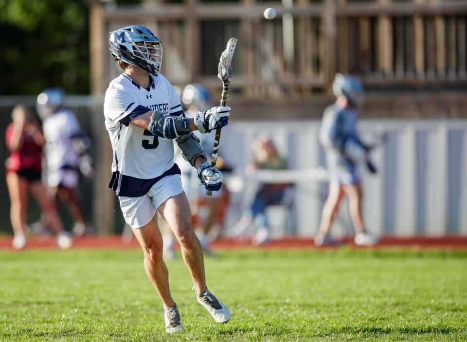 Maclay's Cannon Diehl (5) passes to his teammate. The Gulliver Prep Raiders defeated the Maclay Marauders 14-7 Friday, March 25, 2022.