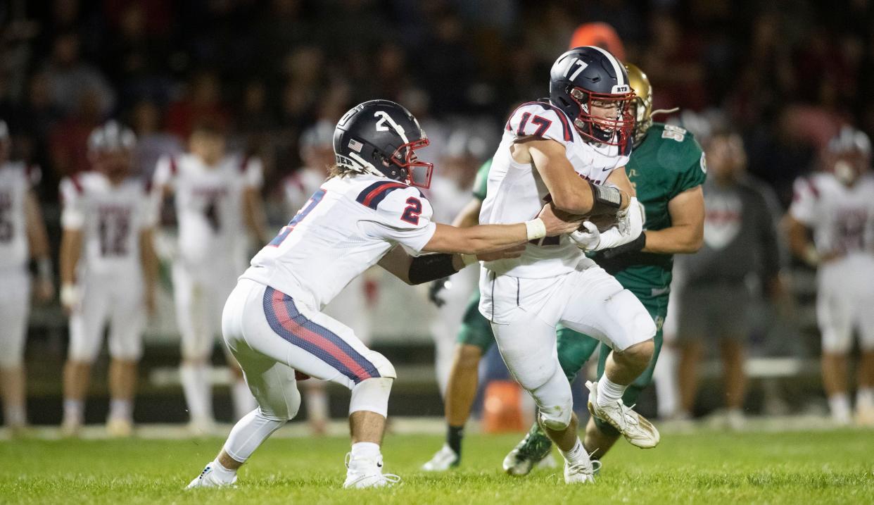 Belvidere North's Nico Bertolino (right), shown here vs. Boylan, had a huge game in the second round of the state football playoffs.