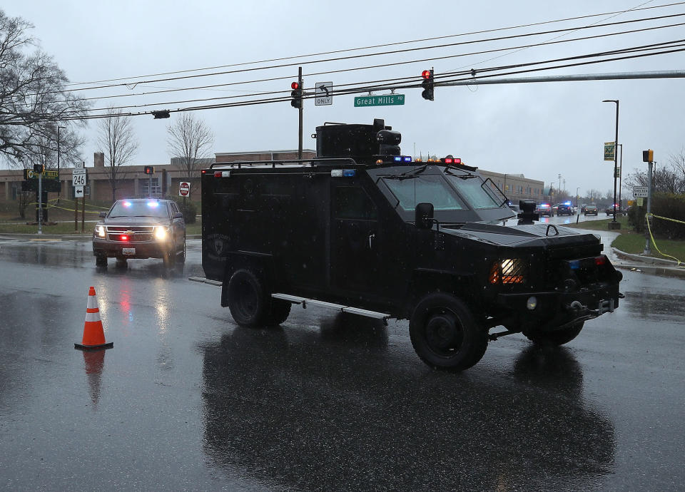 <p>Police vehicles pull out of Great Mills High School after a shooting on March 20, 2018 in Great Mills, Md. (Photo: Mark Wilson/Getty Images) </p>