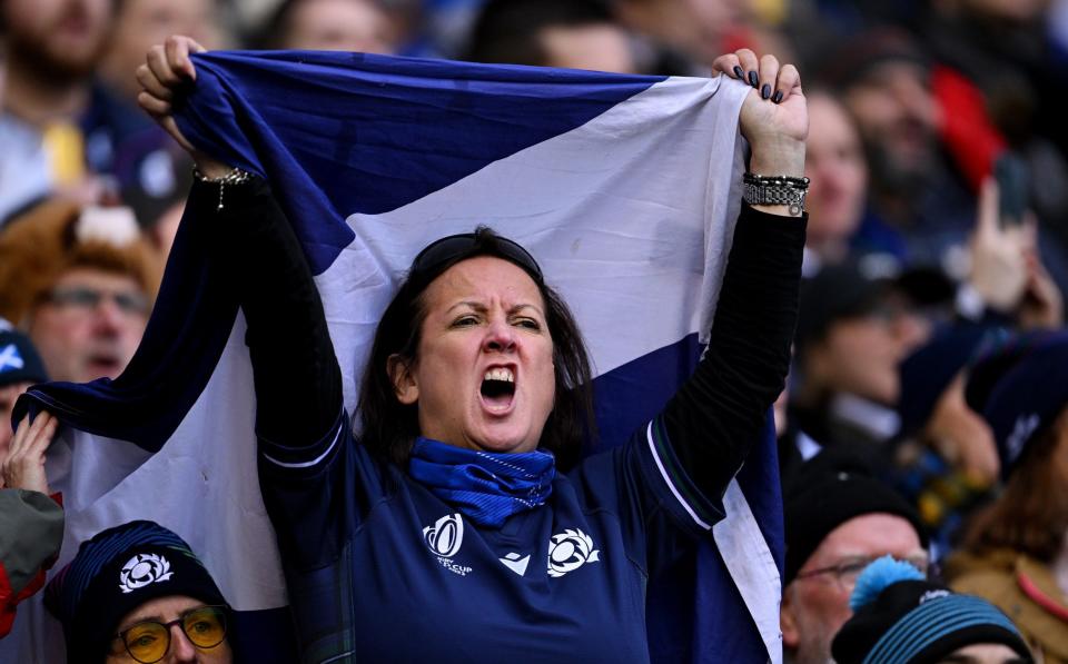 A Scotland fan sings Flower of Scotland before their Six Nations match against France