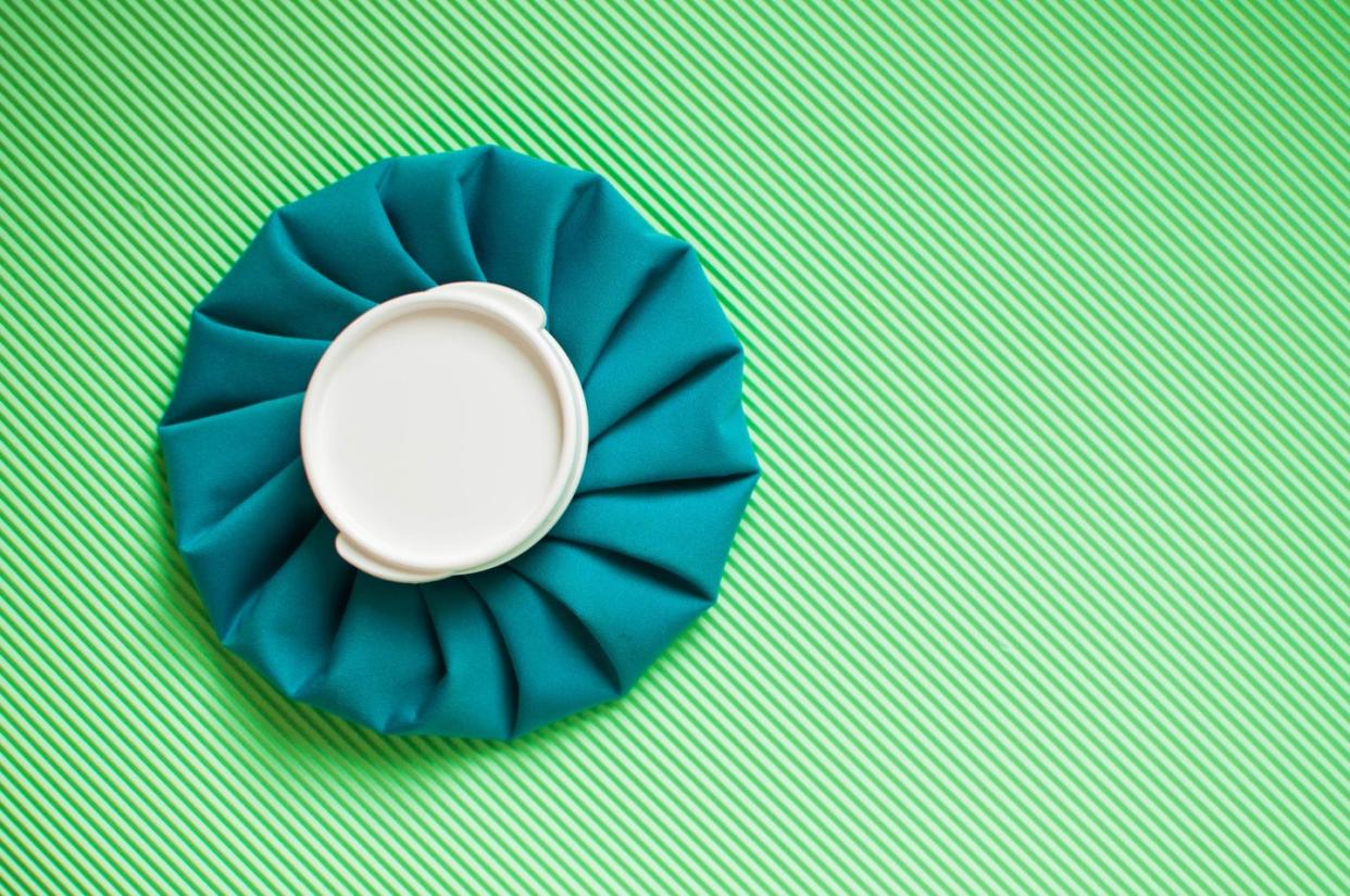 a flat lay of a green ice pack on a green background