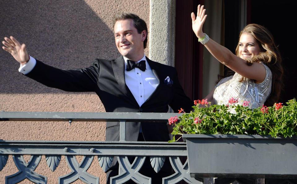 Christopher O'Neill, from the US, left, and Swedish Princess Madeleine, right, wave from the balcony of the Grand Hotel in Stockholm, Sweden, Friday June 7, 2013, prior to a dinner for the couple at the hotel, the day before their wedding. Three years ago she crossed the Atlantic with a broken heart. Now Sweden's "party princess" returns from New York to Stockholm to tie the knot with her new, British-American love. On Saturday, Princess Madeleine — the Duchess of Halsingland and Gastrikland — will wed New York banker Christopher O'Neill in the Swedish capital, bringing together European royals and top New York socialites for a grand celebration. (AP Photo/Scanpix Sweden/Bertil Enevag Ericson) SWEDEN OUT