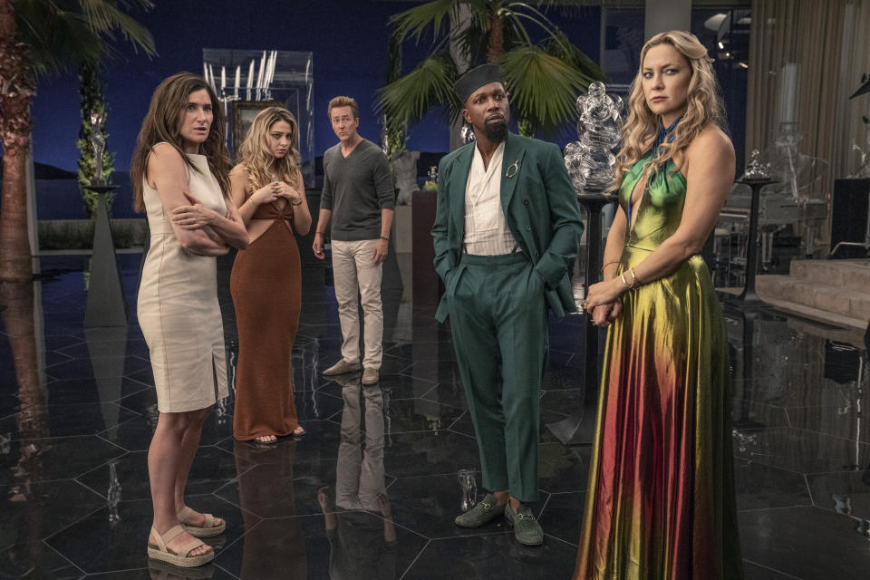 This image released by Netflix shows Kathryn Hahn, from left, Madelyn Cline, Edward Norton, Leslie Odom Jr. and Kate Hudson in a scene from "Glass Onion: A Knives Out Mystery." (John Wilson/Netflix via AP)