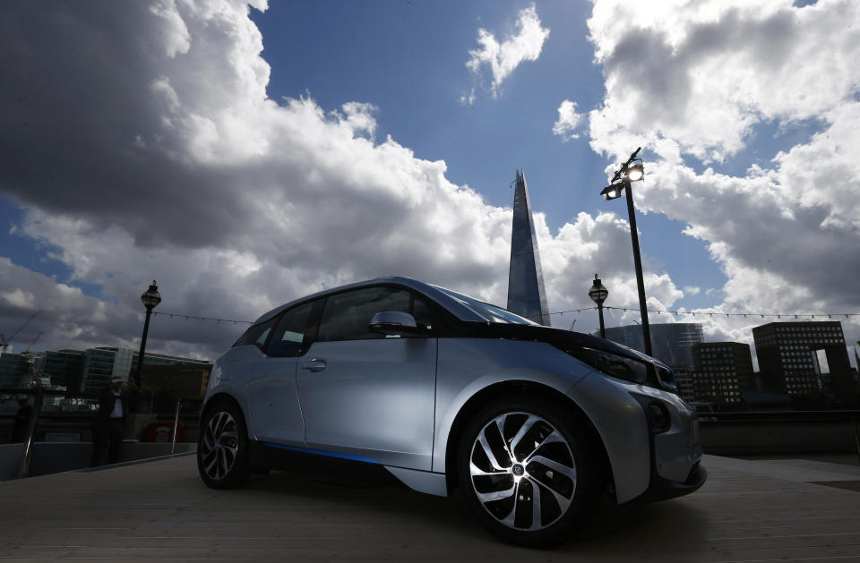 The new BMW i3 electric car is seen, with the Shard building at rear, after it was unveiled at a ceremony in London, July 29, 2013. REUTERS/Andrew Winning  (BRITAIN - Tags: TRANSPORT BUSINESS SCIENCE TECHNOLOGY)