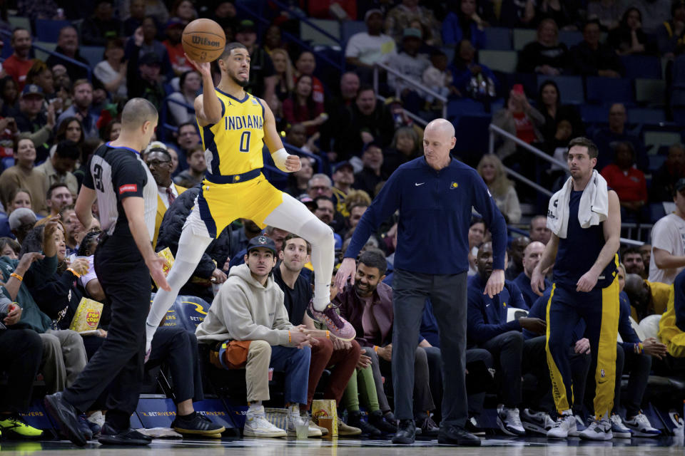 Indiana Pacers coach Rick Carlisle watches as guard Tyrese Haliburton (0) jumps to keep a ball in play during the first half of the team's NBA basketball game against the New Orleans Pelicans in New Orleans, Friday, March 1, 2024. (AP Photo/Matthew Hinton)