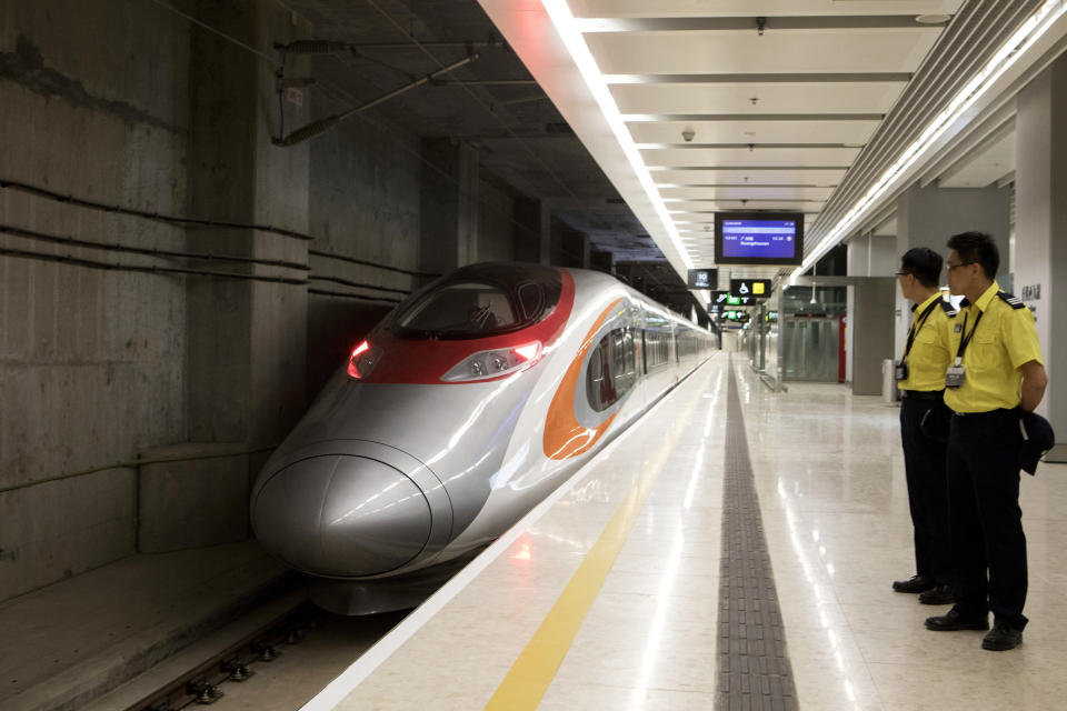 A Guangzhou-Shenzhen-Hong Kong Express Rail Link (XRL) Vibrant Express train bound for Guangzhou Nan Station waits in the Mainland Port Area at West Kowloon Station, which houses the terminal for the XRL in Hong Kong, Saturday, Sept. 22, 2018. (Giulia Marchi/Pool Photo via AP)