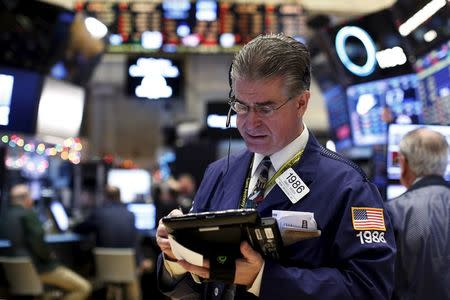 Traders work on the floor of the New York Stock Exchange December 11, 2015. REUTERS/Brendan McDermid