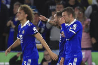 Leicester's James Maddison, centre, celebrates next to Wout Faes, left and Jamie Vardy after scoring his side's third goal during an English Premier League soccer match between Leicester City and Nottingham Forest at the King Power Stadium in Leicester, England, Monday, Oct. 3, 2022. (AP Photo/Leila Coker)