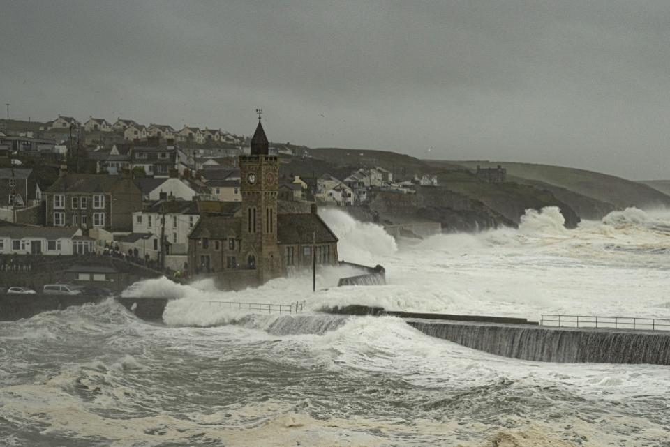 Falmouth Packet: The roads around Porthleven's clock tower are swamped