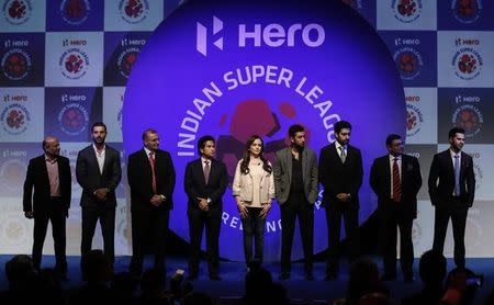 Club owners and other league officials pose for a picture during the emblem-unveiling ceremony of Indian Super League in Mumbai August 28, 2014. REUTERS/Danish Siddiqui/Files