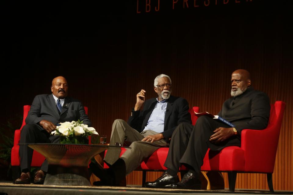 Football Hall of Famer Jim Brown, left, Basketball Hall of Famer Bill Russell, center, and moderator Harry Edwards take part in the "Sports and Race: Leveling the Playing Field" panel during the Civil Rights Summit on Wednesday, April 9, 2014, in Austin, Texas. Brown and Russell discussed using their platforms in their respective sports to raise awareness for civil rights. (AP Photo/Jack Plunkett)