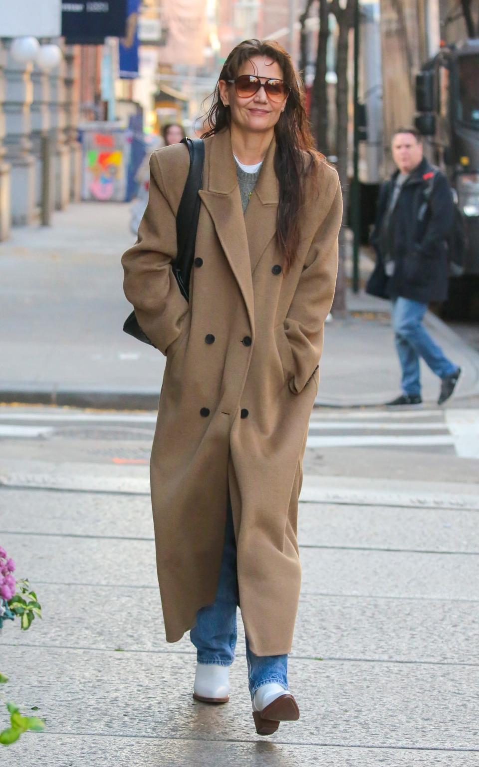 Katie Holmes wore cowboy boots while walking in New York in December