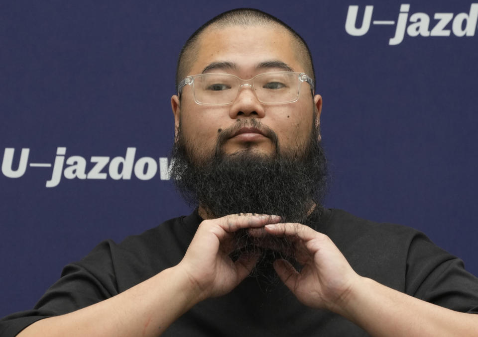 Chinese dissident artist Badiucao during at a news conference ahead of the opening of a new exhibition in Warsaw, Poland on Friday, June 16, 2023. The museum faced demands from the Chinese embassy not to open the exhibition, which is highly critical of China's human rights record. (AP Photo/Czarek Sokolowski)